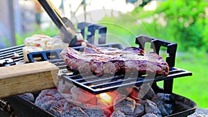 Steak and Scallops grilling on a hibachi on a summer night