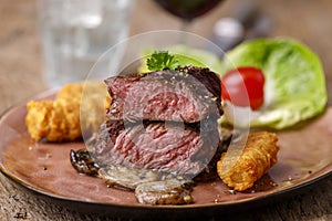 Steak slices with croquettes photo