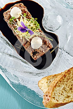 Steak Tartare (Raw Beef) with Sauce on Glass Plate