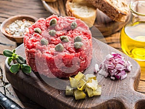 Steak tartare served with capers, pickled cucumbers and chopped onion