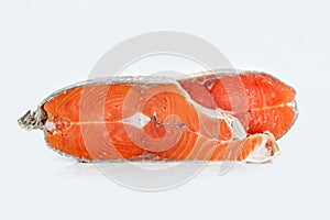 steaks of coho salmon fish after freezing before cooking in a restaurant or kitchen. Wholesome food and diet