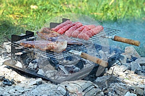 Steaks and kebab on barbecue