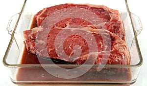 Steaks marinating