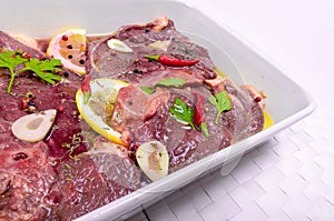 Steaks of red meat , marinated with emulsion of lemon juice and