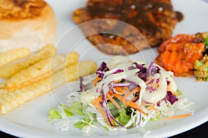 Steaks and vegetable salads.