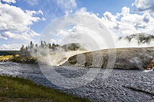 Steam above colorful stones in Yellowstone