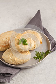 Steam chicken cutlet on a white plate, white background.