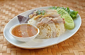 Steam Chicken with Rice (Hainan Chicken) on white plate