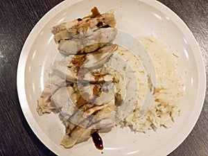Steam Chicken with Rice topped with sweet soy sauce Hainan Chicken