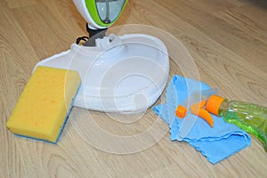 Steam cleaner mop cleaining floor. Cleaning service concept.