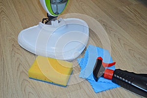 Steam cleaner mop cleaining floor. Cleaning service concept.