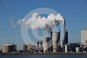 Steam coming out of the chimney at power plant in Rotterdam Maasvlakte in Netherlands