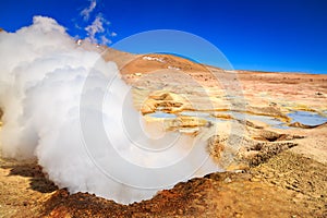Steam coming out of the `Sol de la manana`  geyser in Bolivia photo