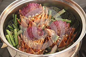 steam cooking cardoon flowers and asparagus