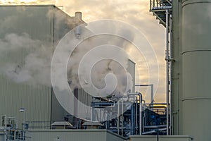 Steam emitted from the smokestack of a Power Plant in Utah Valley at sunset