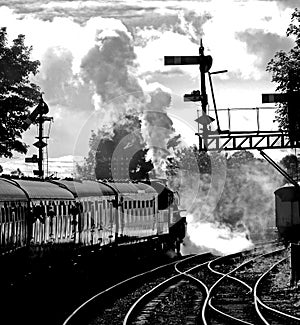 Steam Engine and Train at Severn Valley Railway, in full steam leaving Bridgnorth Station, England