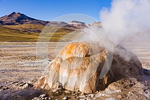 Steam from a geyser in Los Flamencos National Reserve photo