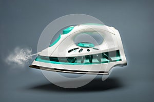 Steam iron on gray background - floating in the air