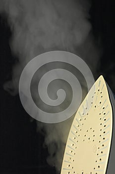 Steam iron isolated on black