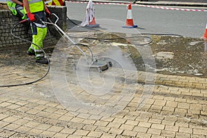 Steam jet wash cleaner on the sidwalk