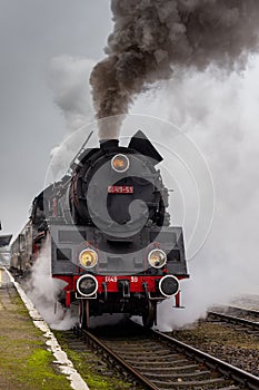 Steam locomotion manoovering on the train station