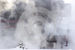 Steam Locomotive Completely Swathed in Steam