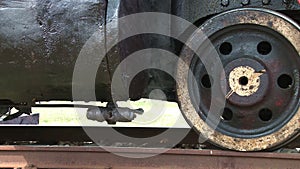 Steam locomotive detail as engine departs