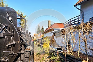 Steam locomotive drives through a residential area in Wernigerode. Dynamic due to motion blur