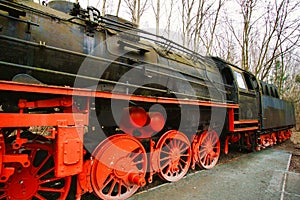 Steam locomotive parked at a terminal station. Historical railroad from 1940