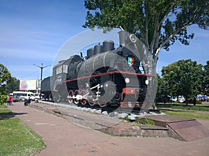 Steam locomotive at the railway station in the city of Krivoi Rog in Ukraine photo