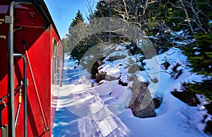 Steam locomotive ride in winter with snow. Dynamics through motion blur