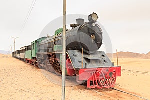 Steam locomotive and train wagons at Hejaz railway station near Wadi Rum, Jordan