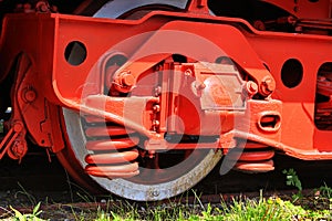 Red wheel and detail of mechanism a vintage romanian steam train locomotive