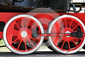 Steam locomotive wheels close-up.