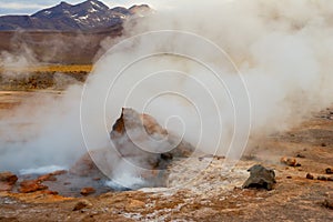 Steam of one of the beautiful El Tatio geysers at sunrise, Chile.