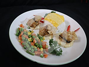 Steam rice with chees, Fish ekado, paprika, Sauteed carrot, Corn and Green peas.