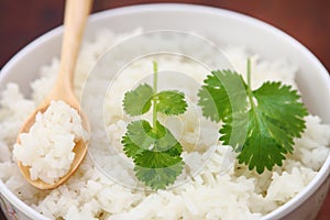 Steam rice with wood spoon
