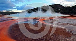 Steam rising off the Grand Prismatic Spring at sunset in Yellowstone National Park in Wyoming US of A