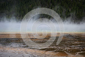 The steam rising over the Grand Prismatic Spring in Yellowstone National Park in Wyoming.