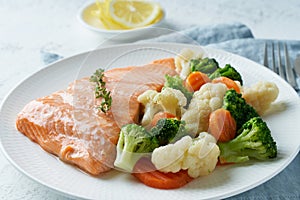 Steam salmon and vegetables, Paleo, keto, fodmap, dash diet. Mediterranean food with fish