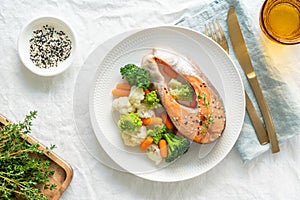 Steam salmon and vegetables, top view. Paleo, keto, fodmap, dash diet.