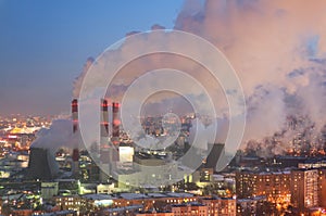 Steam and smoke from the chimneys and cooling towers