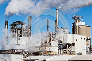 Steam and smoke emitting from an industrial factory smokestack I