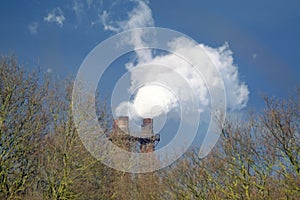 Steam and smoke emitting from steelmaking plant.