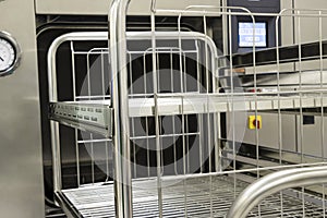 Steam Sterilizer Machine With Sterilization Trolley. Selective Focus