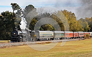 Steam train 4701 going a cross the countryside pulling cars