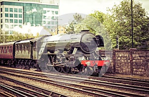 Steam Train Arriving at the City Train Station