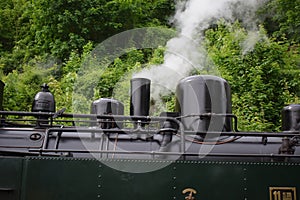 Steam train engine, middle with a small chimney