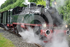 Steam train engine in a steam cloud