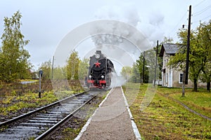 Steam train locomotive on the railway station